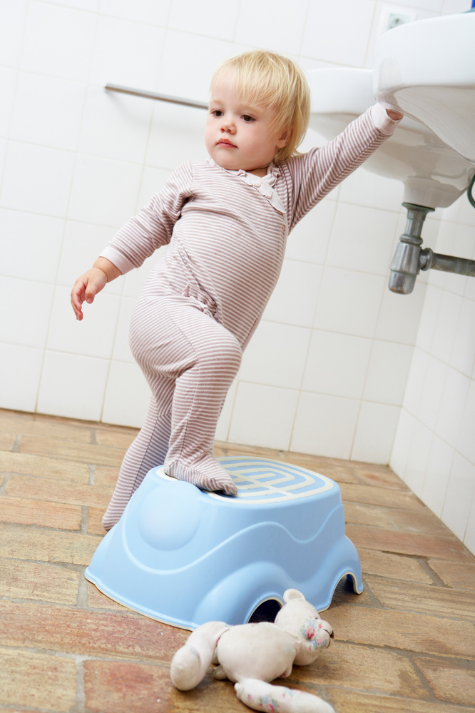 Girl Standing in Bathroom